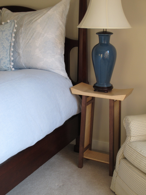 A narrow nightstand with artistically shaped table top - handmade bedside table - solid wood bedroom furniture